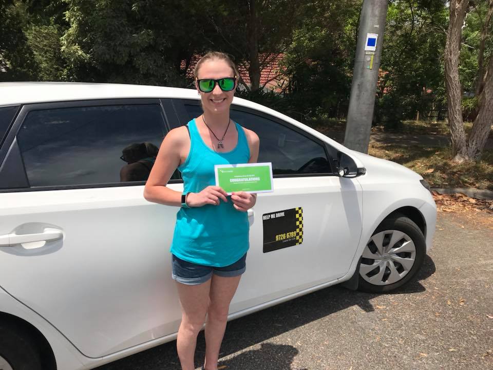 Student celebrating passing driving test with HELP ME DRIVE