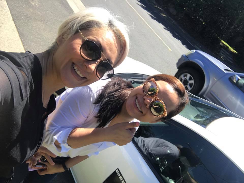 Ellie with happy student after successful driving lesson